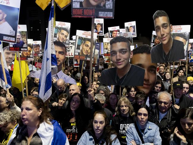 TEL AVIV, ISRAEL - MARCH 1: Protesters hold photos of hostages held by Hamas in the Gaza Strip during a demonstration calling for the release of all hostages on March 1, 2025 in Tel Aviv, Israel. The first phase of the Israel-Hamas ceasefire ended earlier this week, but negotiations on the second phase, which would bring the release of further hostages, have not yet begun. (Photo by Amir Levy/Getty Images)