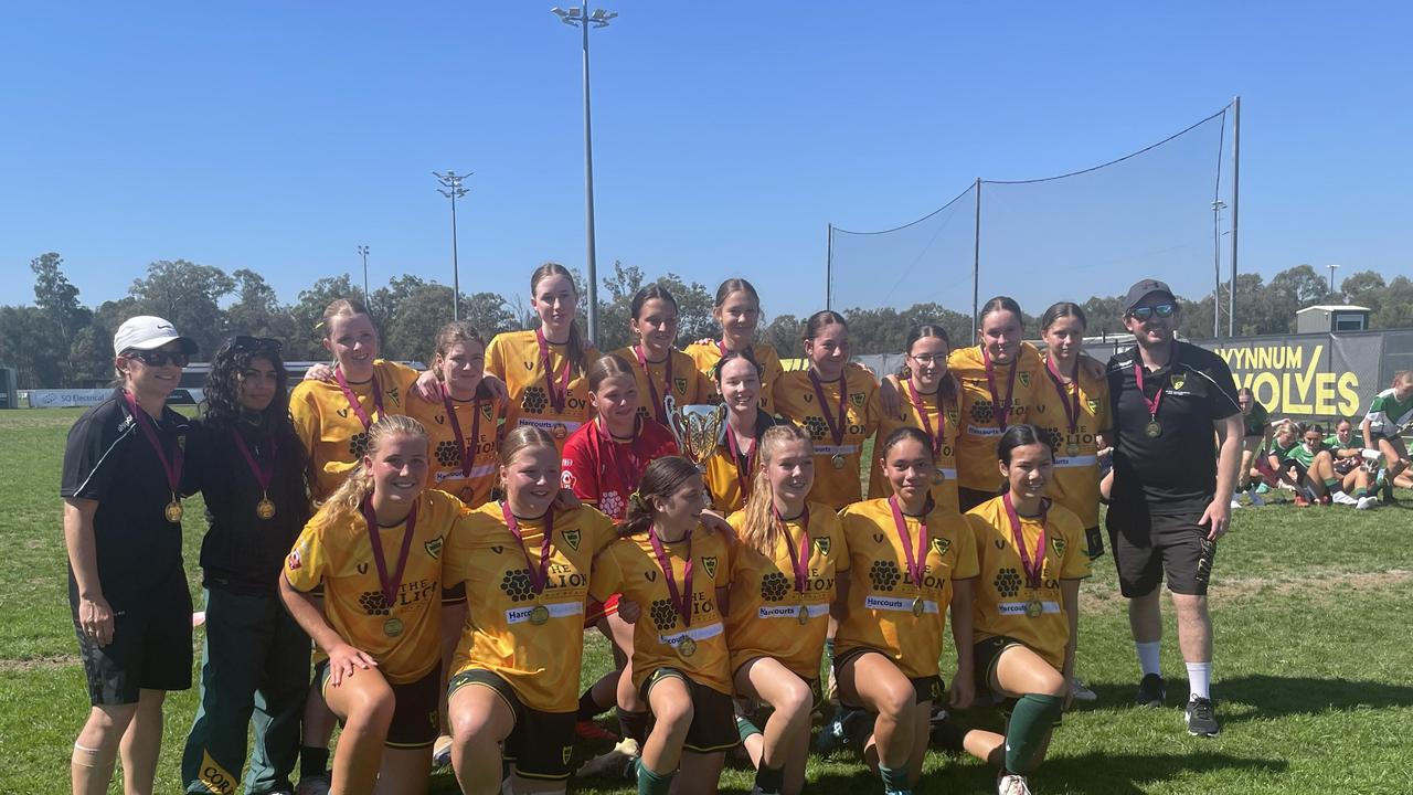 Corinda SHS celebrate a senior girls SPL premiership.