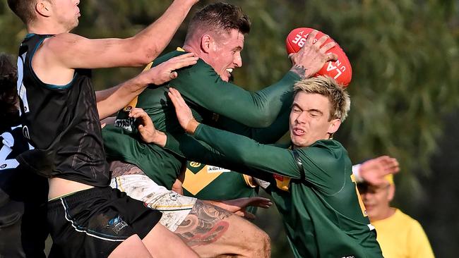 Old Eltham Collegians’ Matthew Keys takes a contested mark. Picture: Andy Brownbill