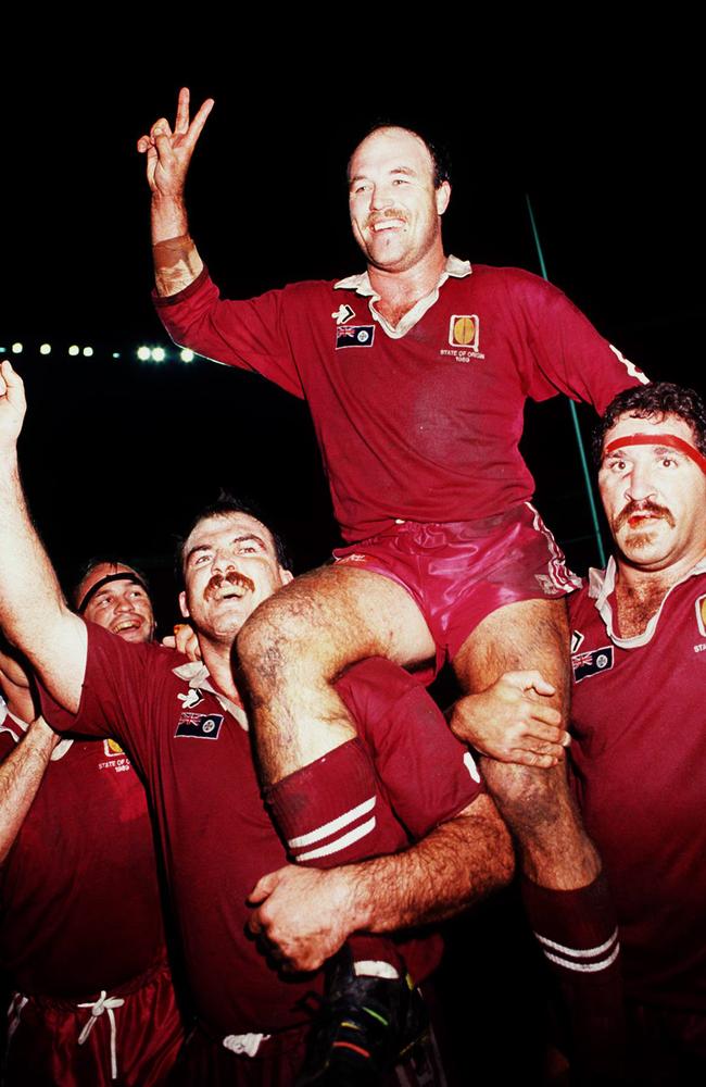 Wally Lewis is carried from the then Lang Park by Martin Bella (left) and Sam Backo after a win during the 1991 State of Origin.