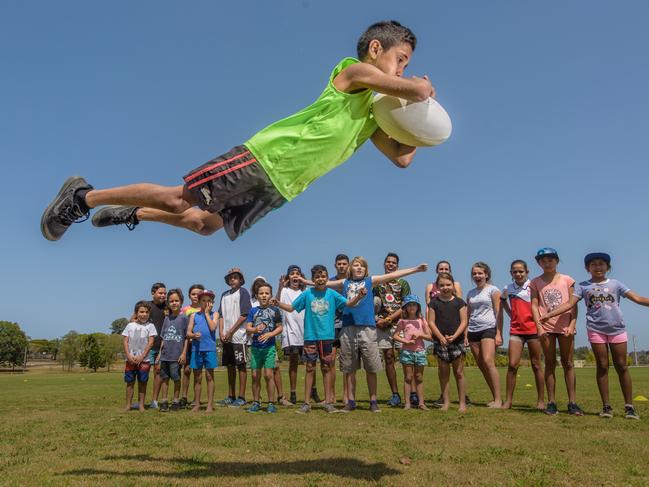 Kshawn Duroux shows some superman try-scoring style at the Camellia Cottage fun day at JJ Lawrence Field in 2017.