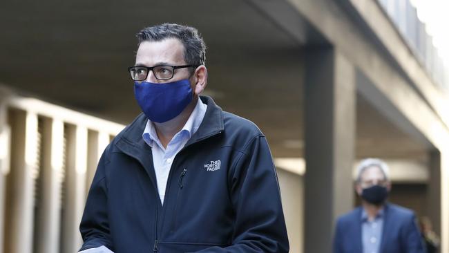 Premier Daniel Andrews and Prof Brett Sutton arrive at the press conference on Sunday morning. Picture: Darrian Traynor/Getty Images.