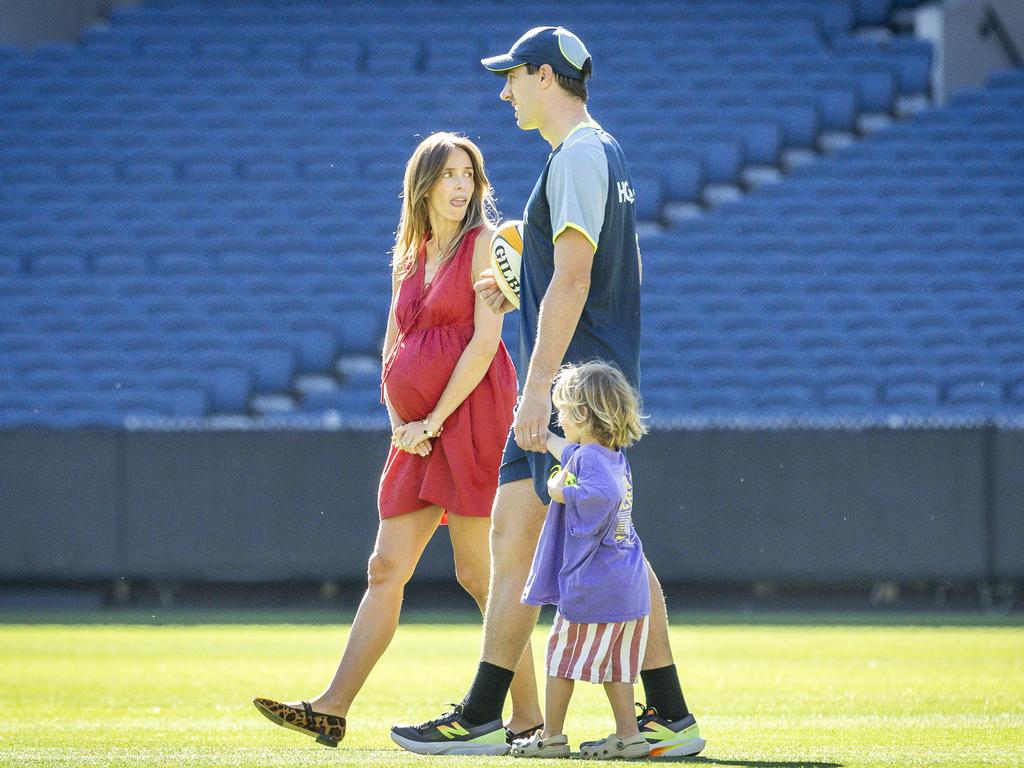 Pat Cummins with his son and wife Becky before the birth of Edith. Picture: Jake Nowakowski