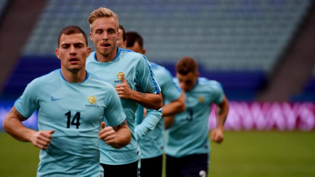 Australia's midfielder Mile Jedinak (2nd L) and teammates attend a training session during the Russia 2017 Confederations Cup football tournament in Sochi on June 18, 2017. / AFP PHOTO / PATRIK STOLLARZ