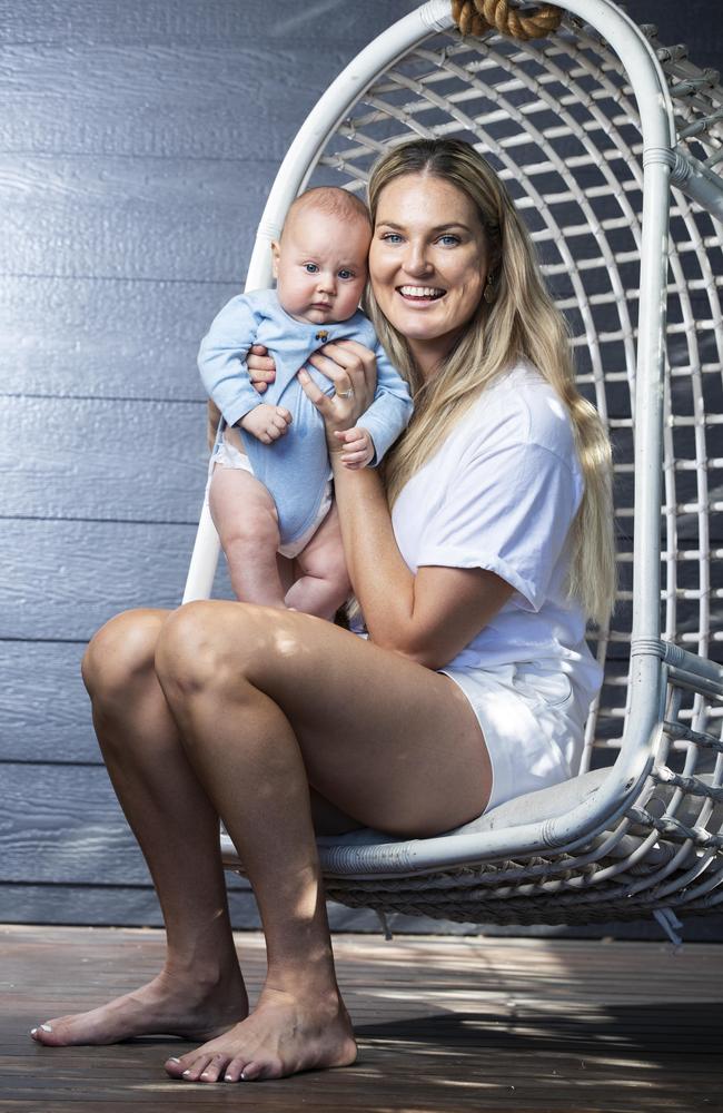 Queensland Firebirds star Gretel Bueta at home with her three-month-old son Bobby. Picture: Lachie Millard.