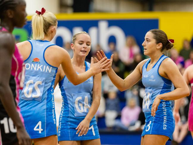 Waratahs Millie Tonkin and Courtney Castle celebrate a goal during the Australian Netball Championships in Canberra. Picture: David Barber / 5 Foot Photography