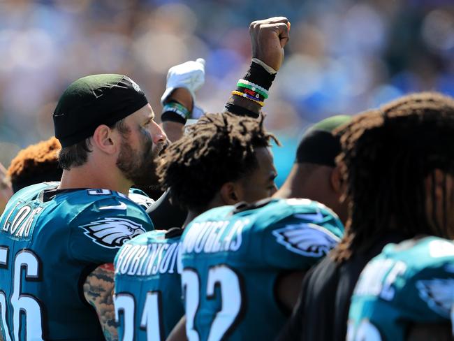 CARSON, CA - OCTOBER 01: Malcolm Jenkins #27 of the Philadelphia Eagles holds up a fist during the national anthem prior to a game against the Los Angeles Chargers at StubHub Center on October 1, 2017 in Carson, California.   Sean M. Haffey/Getty Images/AFP == FOR NEWSPAPERS, INTERNET, TELCOS & TELEVISION USE ONLY ==