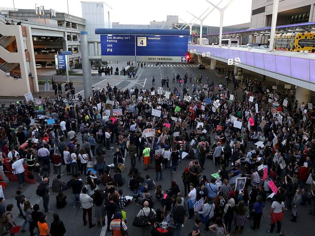 Protesters block a road during a demonstration against the immigration ban imposed by President Donald Trump at Los Angeles International Airport. Picture: Getty