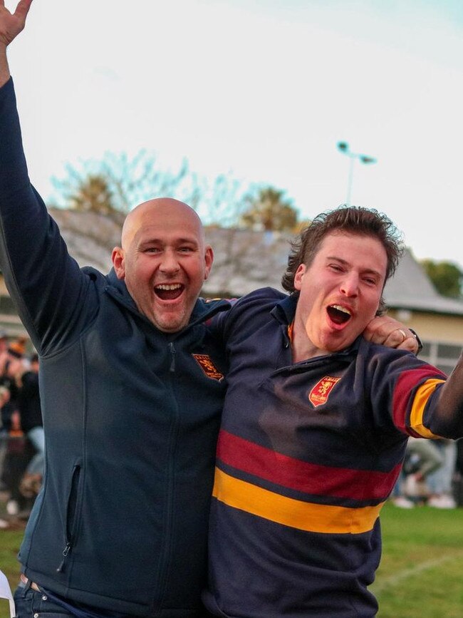 SMOSH West Lakes coach Brad Day (left) celebrates as the siren sounds. Picture: Brayden Goldspink