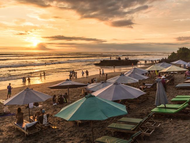 Bali, Indonesia - February 18, 2017: People enjoy the sunset over Canggu beach, north of Kuta and Seminyak, in Bali in Indonesia. Canggu is popular with surfers and expats. Picture: iStock