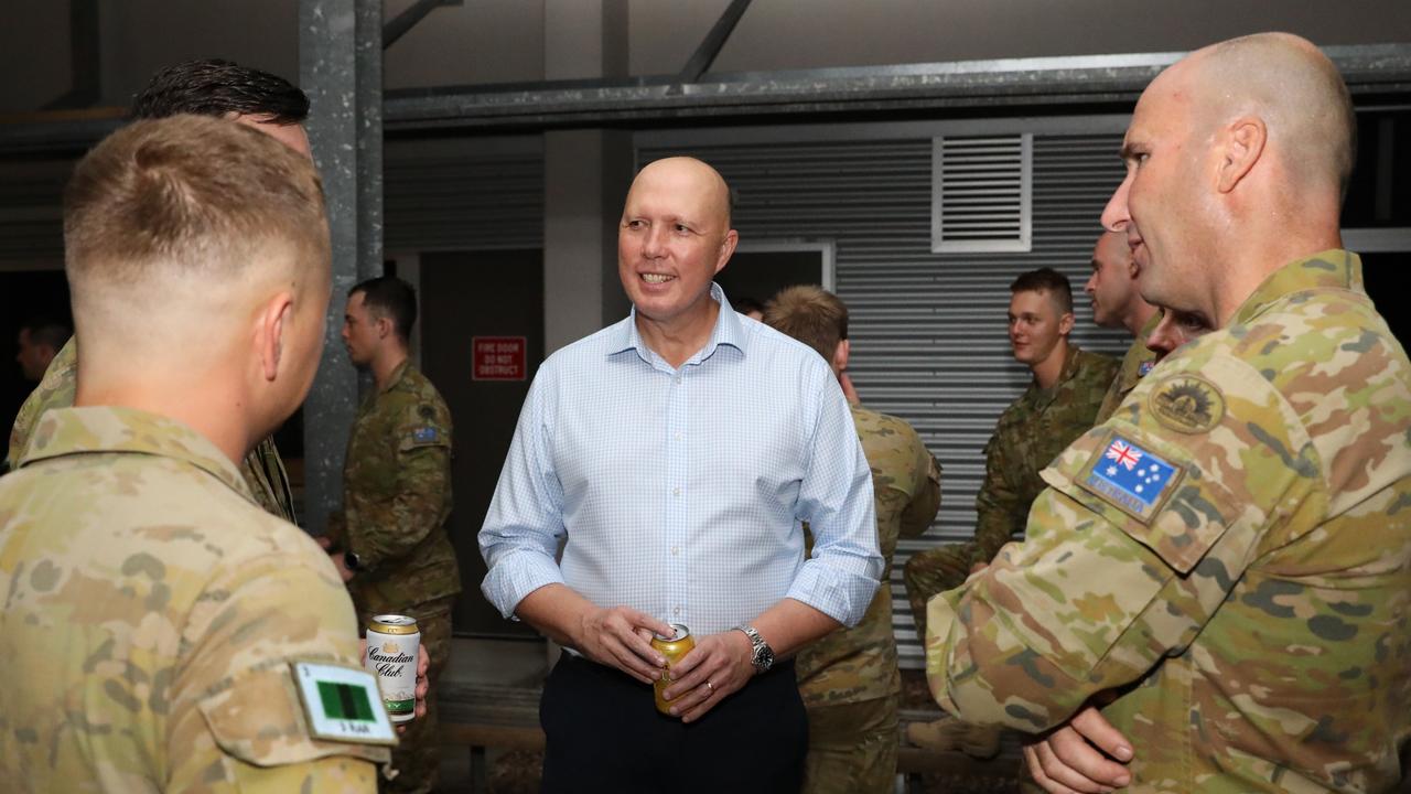 Minister for Defence Peter Dutton speaks with military personnel at Lavarack Barracks in Townsville. Picture: Max Bree