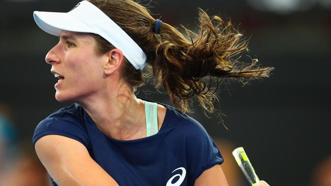 Johanna Konta of Britain hits a return against Madison Keys of the US during their first round women's singles match at the Brisbane International tennis tournament at the Pat Rafter Arena in Brisbane on January 1, 2018. / AFP PHOTO / Patrick HAMILTON / --IMAGE RESTRICTED TO EDITORIAL USE — STRICTLY NO COMMERCIAL USE —