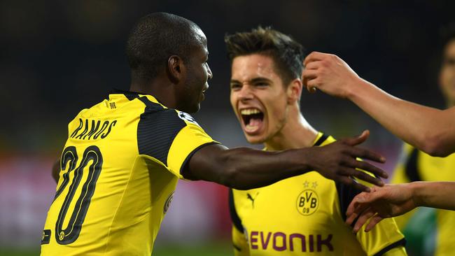 Dortmund's Columbian striker Adrian Ramos (L) celebrates scoring with team mates.