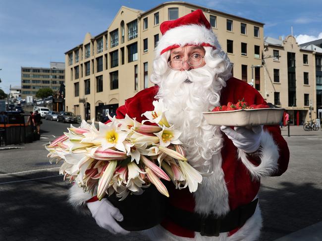 Santa with produce ready for the Christmas Eve edition of Salamanca Market. Picture: Nikki Davis-Jones