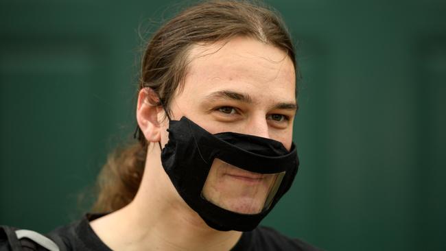 A protester wears a transparent face mask as he attends an Extinction Rebellion demonstration in Manchester, England, over the weekend. Picture: AFP