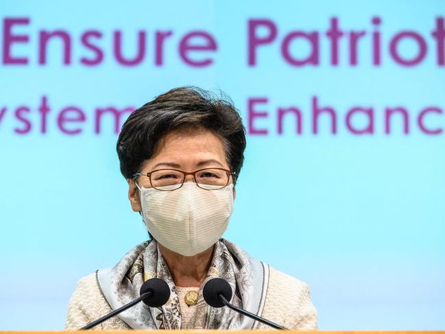 Hong Kong Chief Executive Carrie Lam speaks to the press at the Government Headquarters in Hong Kong on March 11, 2021, after electoral changes for the city were voted in by Chinaâs National Peopleâs Congress. (Photo by Anthony WALLACE / AFP)