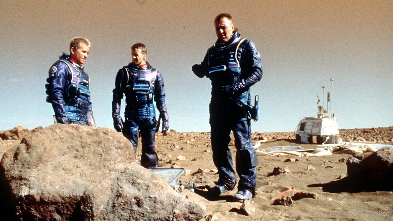 Actors Val Kilmer, left, and Simon Baker, centre, in a scene from Red Planet.