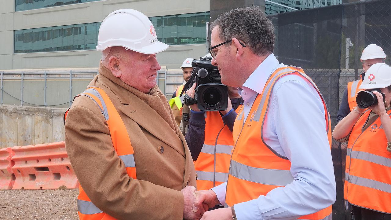 Lindsay Fox shakes hands with Premier Daniel Andrews at the site where the new Alfred’s Melanoma and Cancer Centre will be in Melbourne last year. Picture: NCA NewsWire / Luis Enrique Ascui