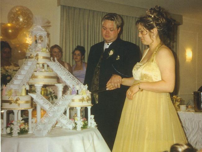 Carl and his pregnant wife Roberta Mercieca cut their cake. Picture: Big Shots/Adam Shand/Penguin