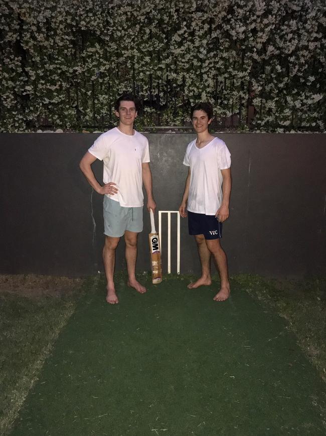 Jack Clayton, left, with his brother Max at their old Indooroopilly backyard pitch.