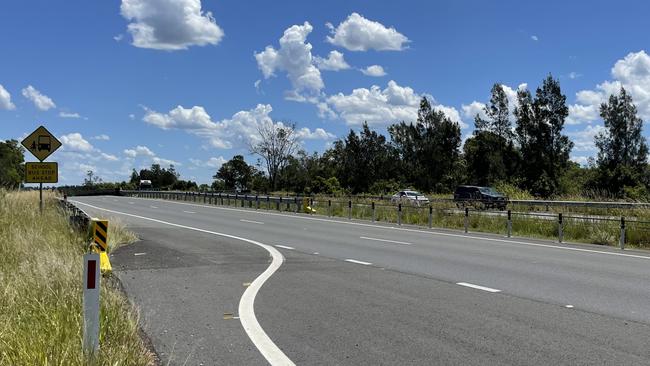 Police on the side of the Pacific Highway north of Taree near the Ghinni Ghinni Bridge on Wednesday afternoon, February 14.