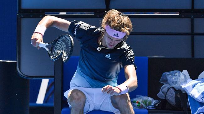 Germany's Alexander Zverev smashes his racquet