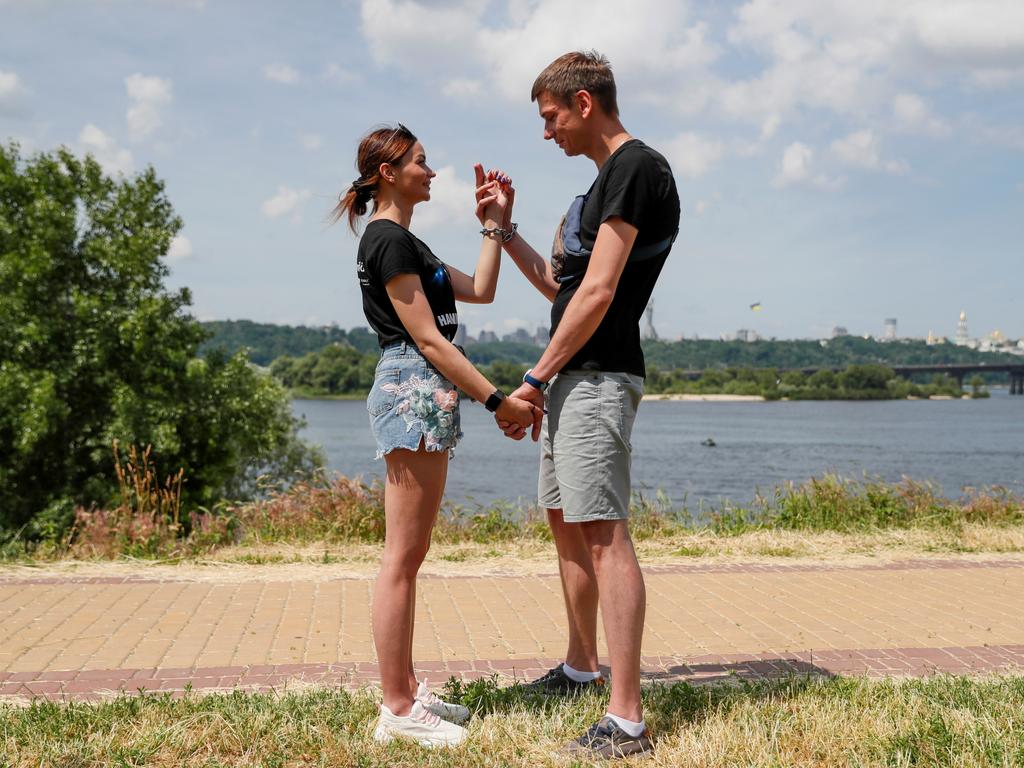 The stresses of the handcuffed experiment took a severe toll on their love. Picture: REUTERS/Gleb Garanich