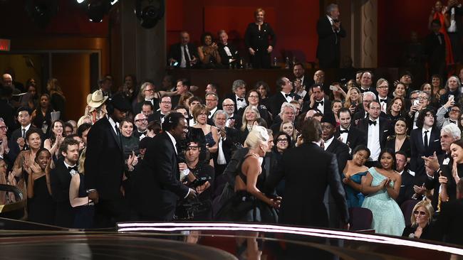 Gaga and Cooper holding hands after the performance. Picture: Matt Petit/A.M.P.A.S. via Getty Images