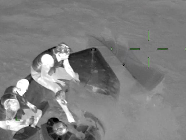 Three men have been rescued after their boat overturned and sank at a popular tourist spot. Picture: Victoria Police