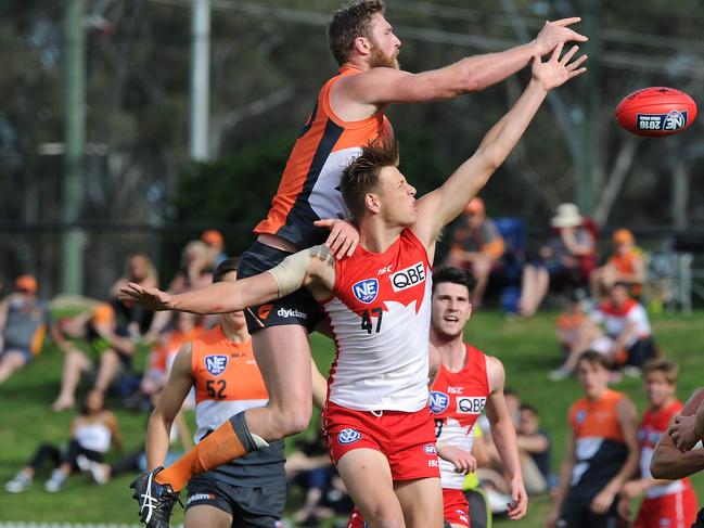 Kyle Galloway competes against GWS ruckman Dawson Simpson in the NEAFL. 