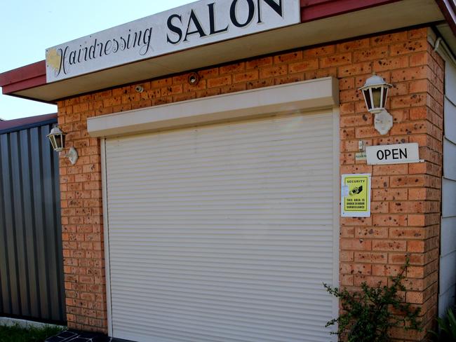 The victim dragged himself to this hairdressing salon and locked himself inside before emergency services arrived.