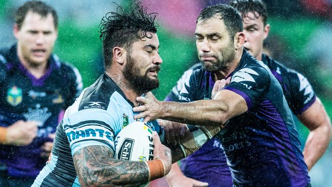 Cronulla's Andrew Fifita palms off Cameron Smith in their last match at AAMI Park. Picture Stuart Walmsley