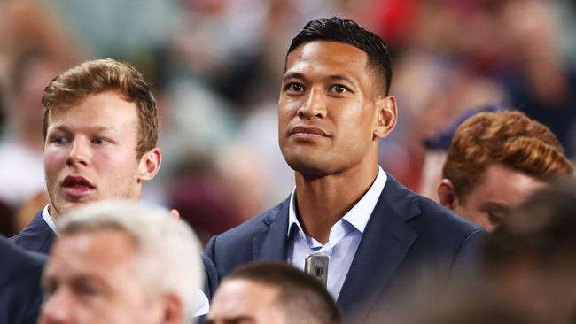 Israel Folau watches the round 10 Super Rugby match between the Waratahs and the Lions from the Allianz Stadium stands last weekend