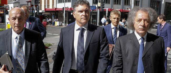 Former Dreamworld CEO Craig Davidson (centre) with Ardent chairman Gary Weiss (right) arriving at the coronial inquest.