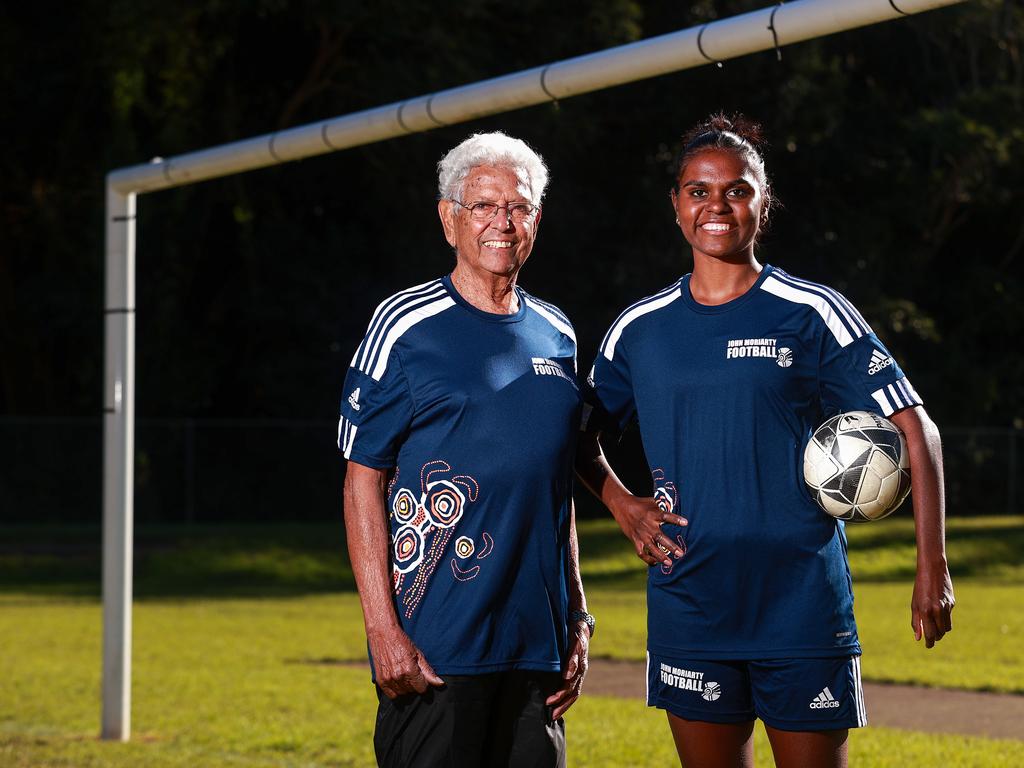 Daily Telegraph. 08, June, 2022. **This is for Indigenous Sports Month.** John Moriarty, with rising star, Shadeene Evans , in Cremorne, today. Football legend John Moriarty's foundation has helped countless children from remote communities discover the world game and help them to a better life. Picture: Justin Lloyd.