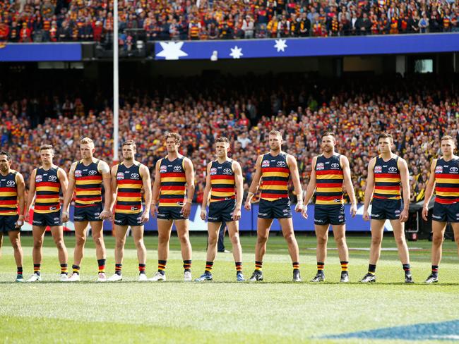 MELBOURNE, VICTORIA - SEPTEMBER 30:  Adelaide Crows players line up for the national anthem before the 2017 AFL Grand Final match between the Adelaide Crows and the Richmond Tigers at Melbourne Cricket Ground on September 30, 2017 in Melbourne, Australia.  (Photo by Darrian Traynor/AFL Media/Getty Images)