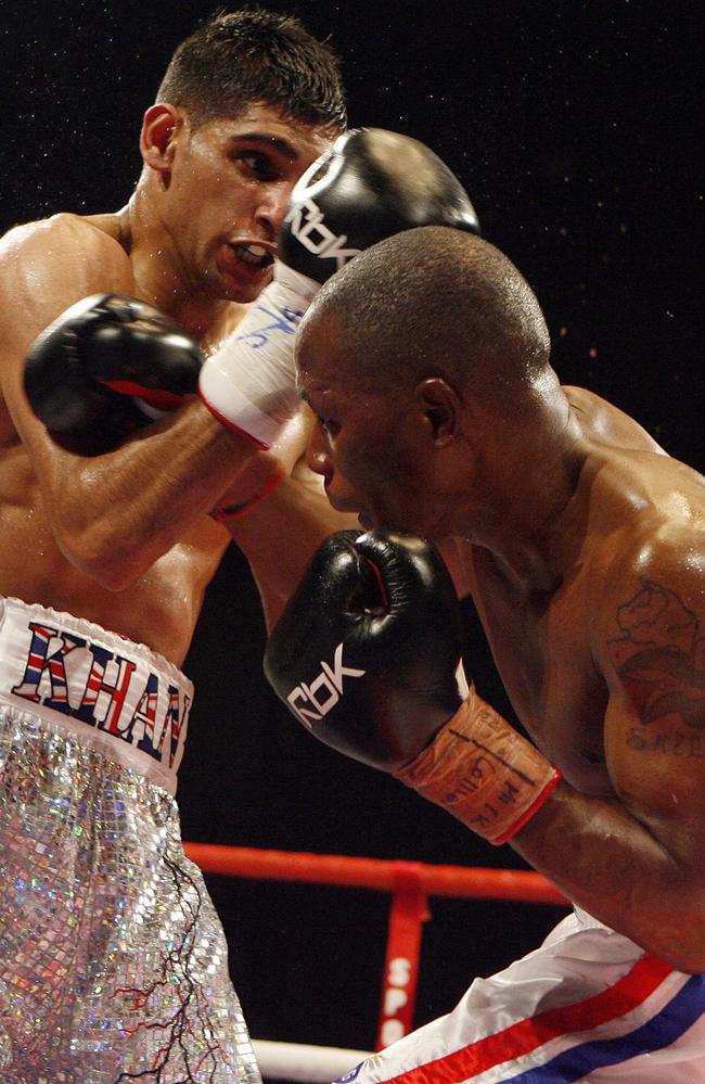 Britain's Amir Khan (left) throws a punch at Gairy St Clair of Australia during their Commonwealth lightweight title boxing match at the ExCel Centre in London in 2008.