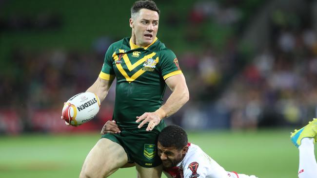 Cooper Cronk tries to break through the England defence.