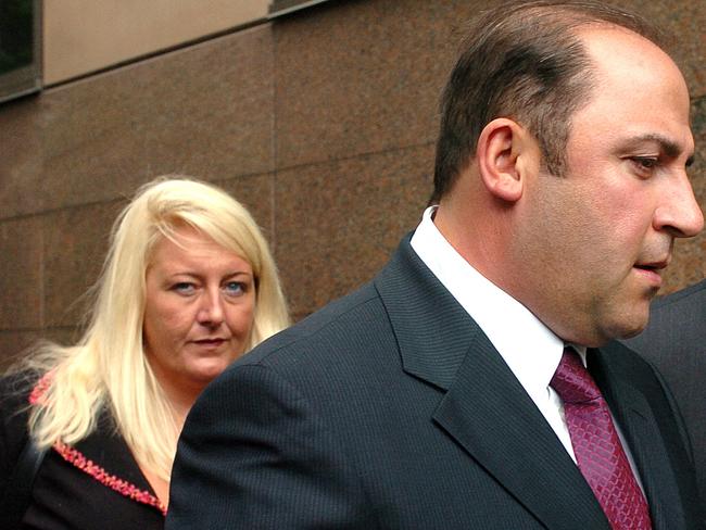 15 Nov 2004 : Gangland boss, Tony Mokbel with his legal team Nicola Gobbo (left) and Con Heliotis QC (right) outside the Magistrates Court - crime Vic drugs headshot mobile phone profile