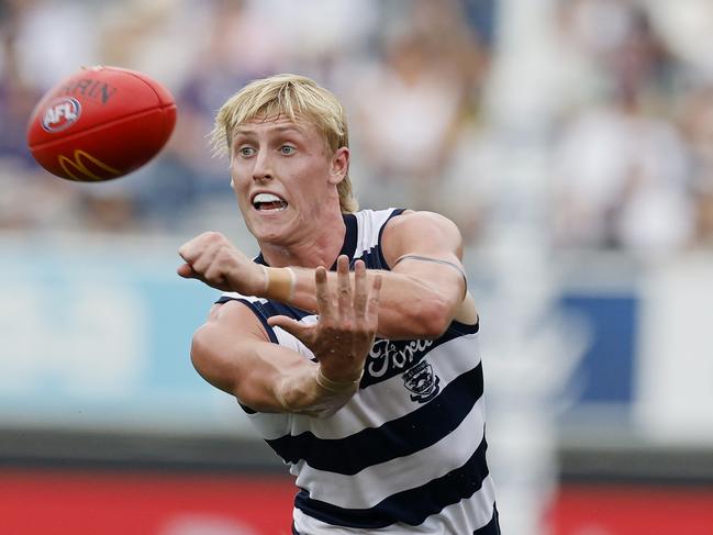 Mitch Knevitt shoots out a handball. Picture: Michael Klein