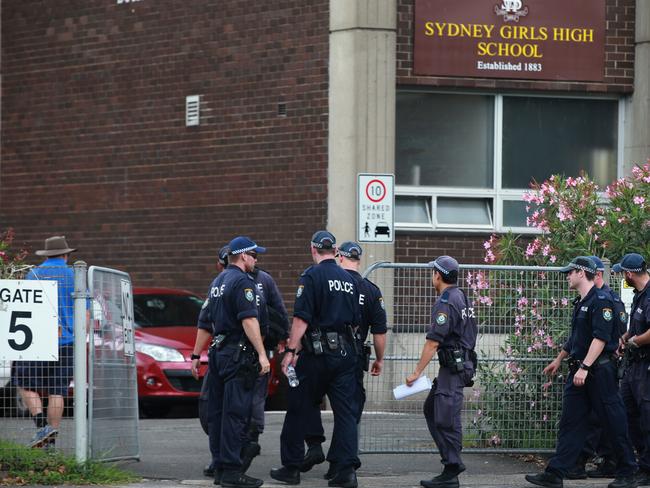 Police stand guard outside Sydney Girls High School after it was evacuated. Picture: Cameron Richardson