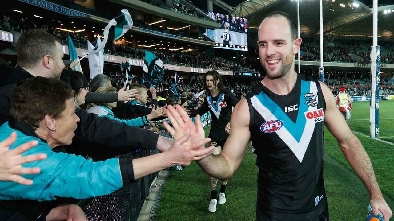 ADELAIDE, AUSTRALIA - JULY 29: Matthew Broadbent of the Power celebrates the win with fans during the round 19 AFL match between the Port Adelaide Power and the St Kilda Saints at Adelaide Oval on July 29, 2017 in Adelaide, Australia.  (Photo by Michael Dodge/Getty Images)