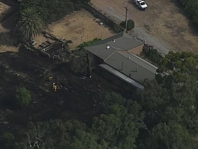 A fire has come very close to a home at Ashbourne in the southern Adelaide Hills today, 3 Jan 2022. Picture: 7NEWS