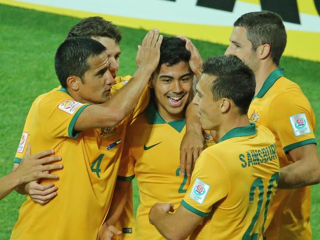 MELBOURNE, AUSTRALIA - JANUARY 09: Massimo Luongo of the Socceroos is congratulated by Tim Cahill and his teammates after scoring a goal during the 2015 Asian Cup match between the Australian Socceroos and Kuwait at AAMI Park on January 9, 2015 in Melbourne, Australia. (Photo by Scott Barbour/Getty Images)