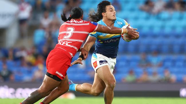 Tino Fa'asuamaleaui of the Titans is tackled during the round six NRL match between Gold Coast Titans and St George Illawarra Dragons at Cbus Super Stadium on April 09, 2023 in Gold Coast, Australia. (Photo by Chris Hyde/Getty Images)