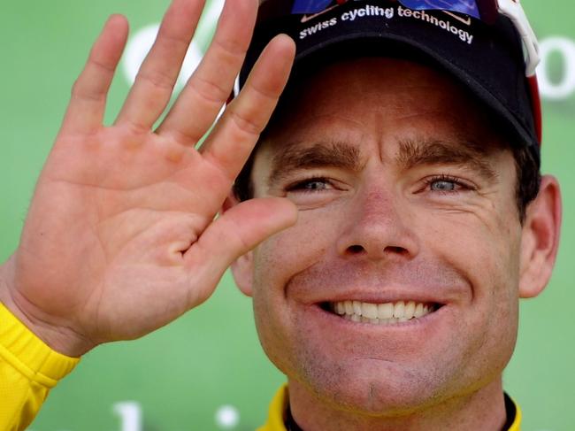 01/05/2011 WIRE: Australia's Cadel Evans celebrates on the podium after winning the Tour de Romandie, a six-day race over 164.6km km between Champagne and Geneva, on May 1, 2011 in Geneva. AFP PHOTO / FABRICE COFFRINI