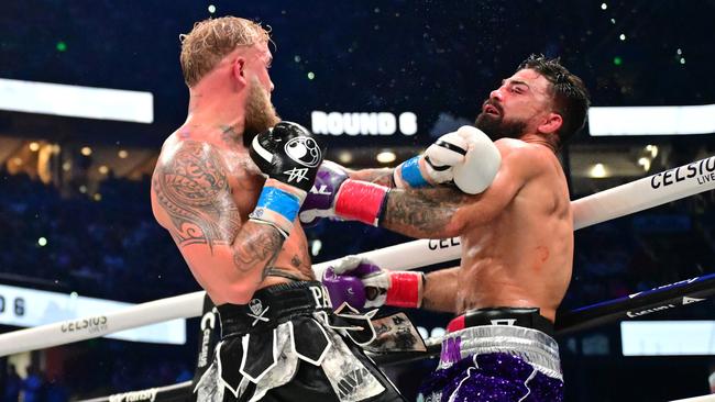 Jake Paul punches Mike Perry during their cruiserweight fight. (Photo by Julio Aguilar/Getty Images)