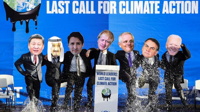 Climate change activists dressed as world leader during a demonstration in the Forth and Clyde Canal in Glasgow during the COP26 UN Climate Change Conference.