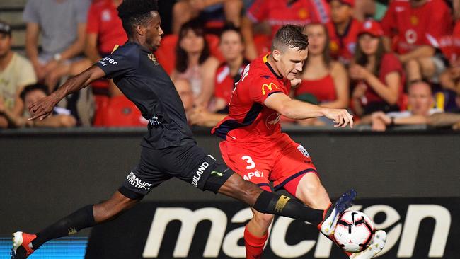 Bruce Kamau, left, of the Wanderers and Scott Galloway of United compete for the ball. Picture: Getty Images