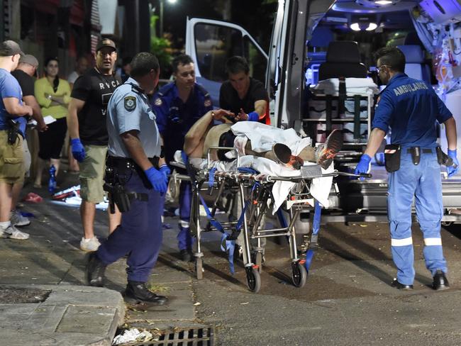 A man is rushed to hospital after receiving multiple stab wounds in Waterloo. Picture: Gordon McComiskie